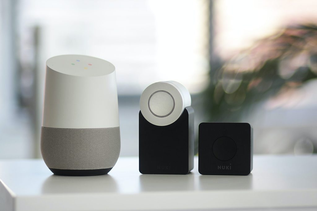 white and gray Google smart speaker and two black speakers - We Fix IT